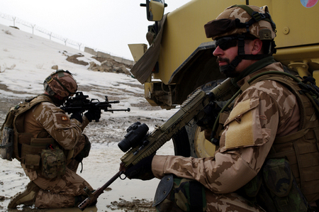 Soldiers get cover behind vehicles