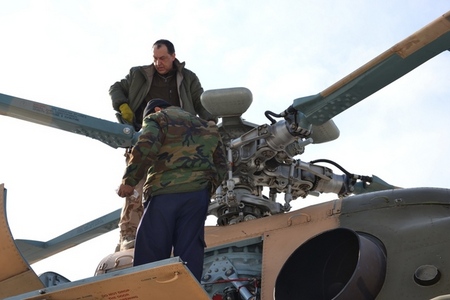 Technician WO Zdenek R. with his Afghan colleague check Mi-17 before take off