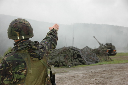 British soldier shows an arc of fire