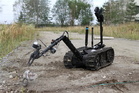  Robot TALON při zneškodňování IED