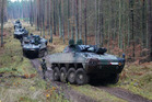  Obrněné transportéry při přesunu