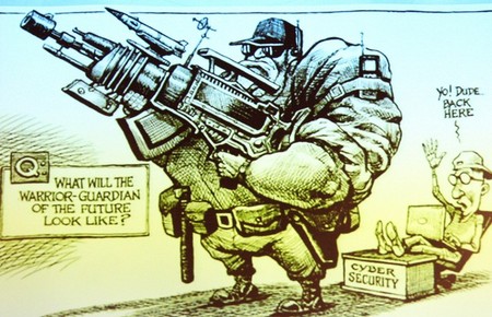 Letecký komodor ve výslužbě Bruce Wynn prezentoval karikaturu z časopisu The Economist, která výstižně zobrazuje problematiku kybernetické bezpečnosti ozbrojených sil. Voják budoucnosti je na dálku ovládán pubescentním hackerem, který pohrdá nedokonalým kybernetickým zabezpečením.